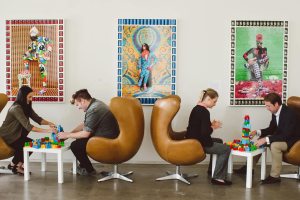 People sitting in chairs for a meeting or event at 21c Bentonville.